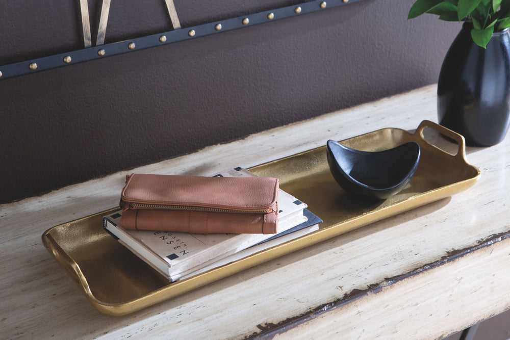 This tray was made for serving up superb style. Goldtone finished cast aluminum sets a sturdy foundation. This is the perfect fashionable piece for quickly adding versatility to your home.<br/><br/><b>Product Features</b><ul><li>Made of cast aluminum</li>