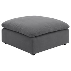 Elevate your living space with this versatile and stylish ottoman, perfect for adding both comfort and functionality to your home. Upholstered in a chic charcoal grey performance fabric, this ottoman offers a modern touch that complements a wide range of 