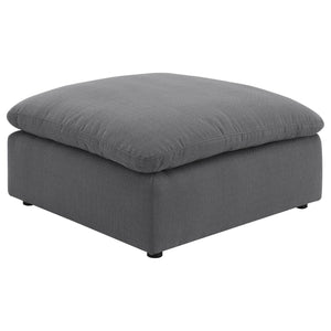 Elevate your living space with this versatile and stylish ottoman, perfect for adding both comfort and functionality to your home. Upholstered in a chic charcoal grey performance fabric, this ottoman offers a modern touch that complements a wide range of 