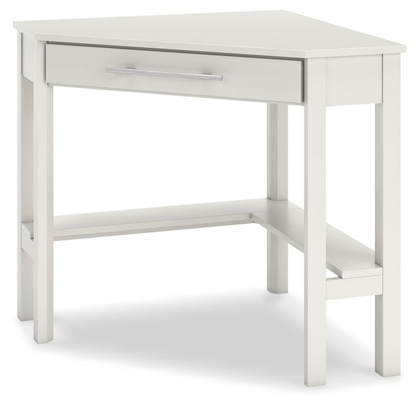  this desk leaves a small footprint as it seamlessly fits into corners. A center storage drawer keeps essentials close