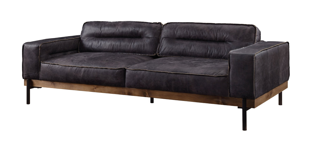 Part of the handsome Silchester Collection, this modern industrial sofa set will look great in any contemporary space. Contrast stitching makes the antique ebony top grain leather upholstery pop, and highlights the warm color of the wooden trim base. Meta