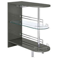 Add a fun retro feel to a modern living area with this contemporary bar table. In a glossy grey finish, the silhouette is cool and neutral. Tempered glass storage shelves offer a clean and open feel while displaying libation bottles in style. Included gua