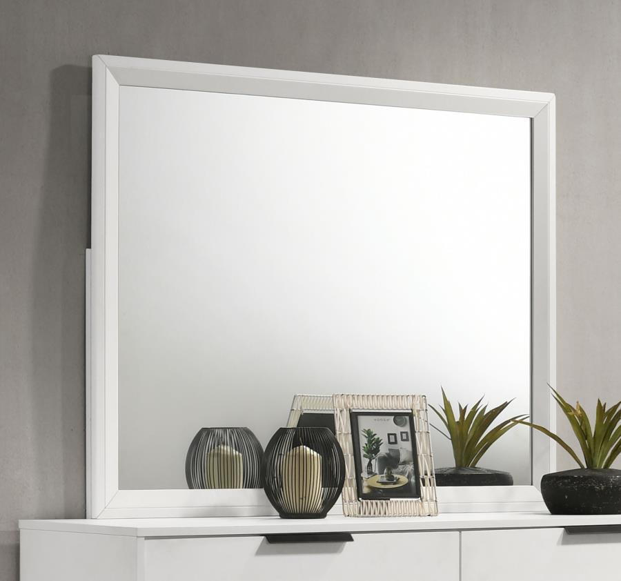Upgrade your bedroom with the stylish look of a modern dresser mirror. This design is framed, with smooth trim and open corners. A white finish is fresh and contemporary, offering versatility to complement a variety of dressers. The mirror mounts to the b