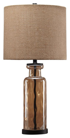 Transparency is in style with this table lamp. A unique pattern reflects in the faceted base as light passes through. Antique bronze-tone metal beautifully complements the champagne glass finish. Burlap shade adds texture to the smooth design.<br><br><b>A