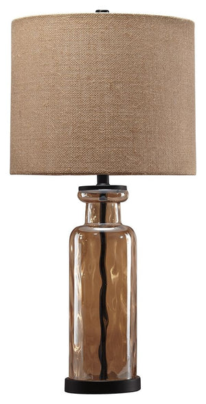 Transparency is in style with this table lamp. A unique pattern reflects in the faceted base as light passes through. Antique bronze-tone metal beautifully complements the champagne glass finish. Burlap shade adds texture to the smooth design.<br><br><b>A