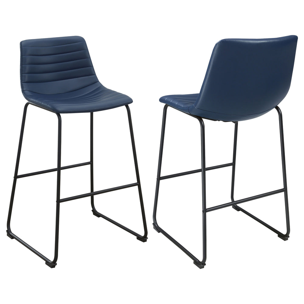 Upgrade kitchen or lounge seating with the refined look of a set of two contemporary barstools. Each boasts faux leather upholstery over a bucket style seat. Channel tufting adds a sense of depth and movement while highlighting intriguing color. The stool