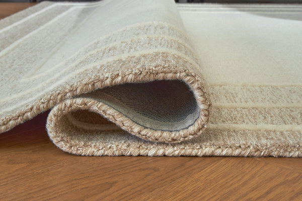  this hand-tufted rug brings a touch of casual elegance to your abode. Its plush wool pile feels luxuriously soft underfootâ€”perfect for adding warmth and texture to your entertainment area