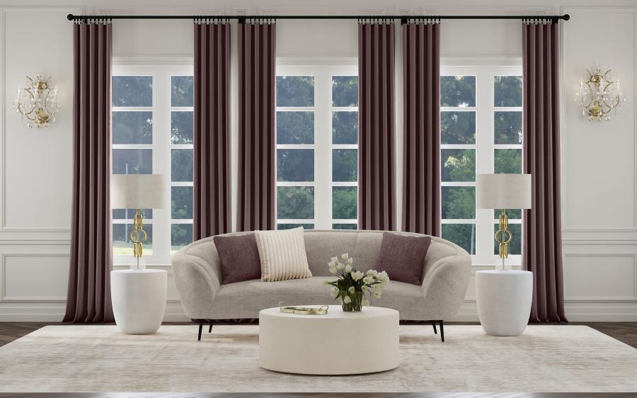 Bring fresh, effervescent energy to your living room with a modern upholstered sofa that shows off your curve appeal. This great piece, in soft beige with wonderful texture, is designed to float in the center of a room as an attractive focal point. Its ro