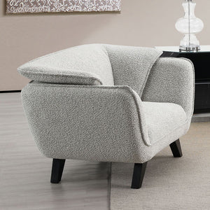 Unwind in the sophisticated charm of the Manon sofa, draped in light gray fabric. Accompanied by plush pillows, it offers a perfect blend of comfort and style. This sofa invites cozy conversations and serene relaxation, making it an ideal addition to any 