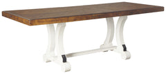 A high-style choice for casual spaces, this dining table serves up the best in rustic farmhouse living. Its two-tone distressed finish pairs a brown tabletop with a vintage white base for a double helping of charm. This extension dining table features an 