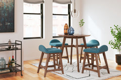 This counter-height dining set is a refreshed take on retro aesthetics. The counter table adds an air of playful simplicity to your dining space and the upholstered bar stool invites the eye with a soft-edged silhouette cushion. This set captures the arch