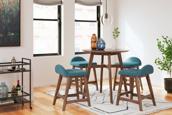This counter-height dining set is a refreshed take on retro aesthetics. The counter table adds an air of playful simplicity to your dining space and the upholstered bar stool invites the eye with a soft-edged silhouette cushion. This set captures the arch