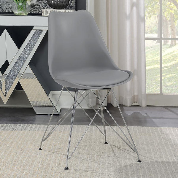  this grey dining chair beautifully updates a contemporary home with its stylish silhouette and sleek materials. The seat and back are covered in smooth leatherette upholstery