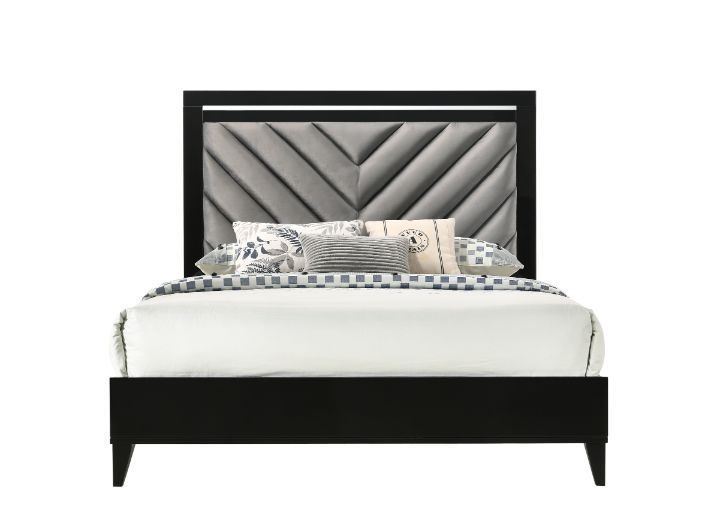 Sleep in style with this modern Chelsie bedroom collection. The sturdy bed is a focal point on its own with its gray channel-tufted headboard and tapered legs. Add depth and reflect light with its silver trim that is featured throughout the bed and case g