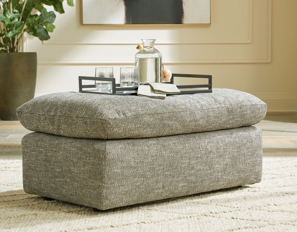On the days when rest and relaxation seem out of reach, this ottoman provides a positively plush foot perch. Its feather-fiber blend cushion invites you to float away in cloud-like comfort. Striking granite-hued upholstery and a streamlined frame grant th