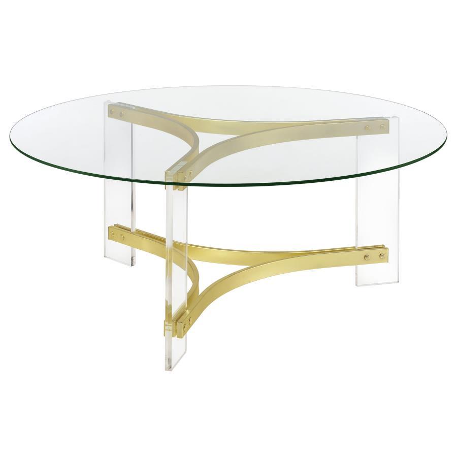 This round coffee table features a clear tempered glass top, offering an elegant surface for any living room. The sleek, clear acrylic legs enhance the modern design, while the matte brass electroplated frame provides a luxurious touch. Its minimalist con