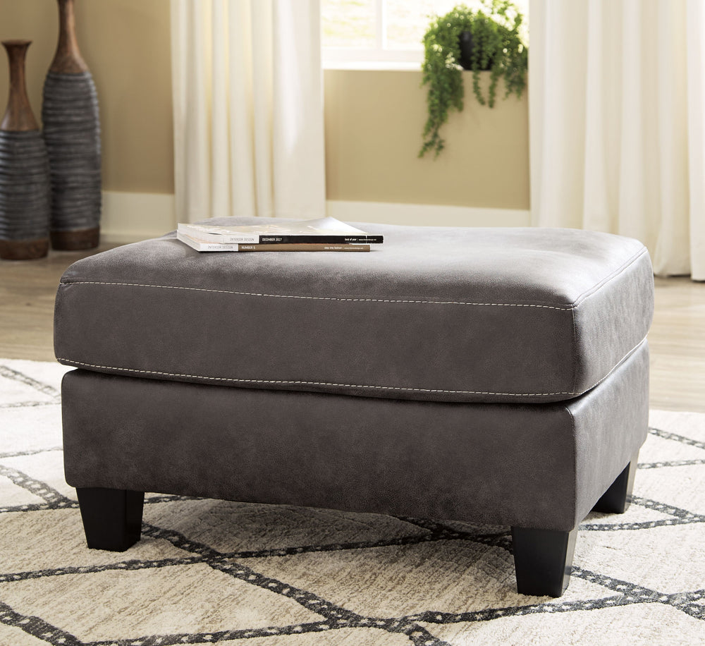 This ultra-contemporary ottoman invites you to kick back and make yourself comfortable. Gunmetal gray faux leather offers the cool, weathered look you love and touchably soft feel you crave.<br><br><b>Additional Dimensions</b><br><ul><li>Leg height: 3-"</