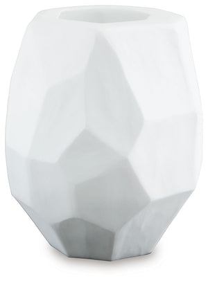 Equal parts elegant and organic, this vase brings ethereal beauty to your tabletop. Its white finish seamlessly harmonizes with existing accents. Meticulous craftsmanship creates the unique, faceted look of the hand-carved surface and makes each piece one