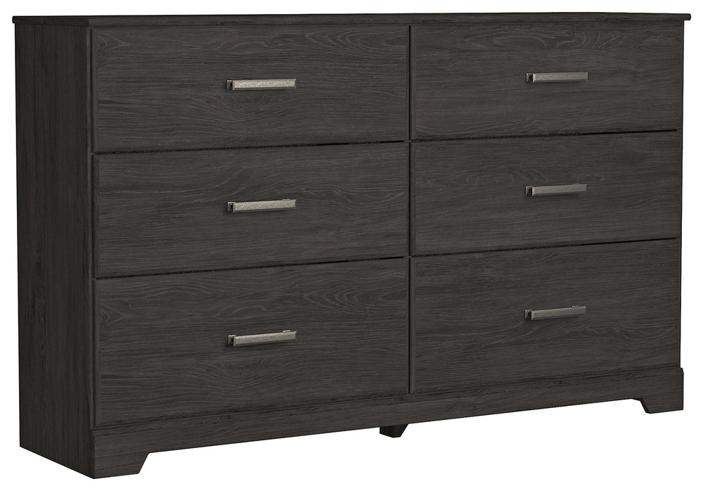 With its clean-lined look and modern attitude, this dresser is a fresh style awakening. A warm charcoal hue over replicated oak grain easily complements other furniture finishes. Smooth drawer fronts with antiqued pewter-tone handles complete the aestheti