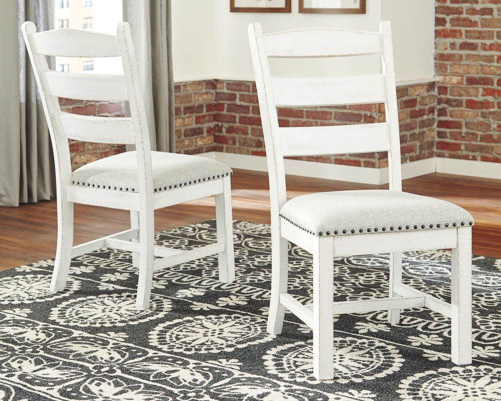 Whether youâ€™re pining for cottage charm or modern farmhouse sophistication, this dining room upholstered chair, with its timeless ladderback styling, is something to savor. The vintage white finish exudes a sense of ease thatâ€™s made all the more entic