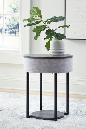  this accent table wows with subtly integrated functional features. Wirelessly connect your audio to its built-in speakers as you host guests or relax solo. Need to charge up as you lounge? Place it next to your sofa t