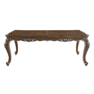  the Latisha dining table is the perfect merging of contemporary and classic. The antique oak finish with the hand-brushed silver trim accentuates the elaborate floral moldings that are showcased throughout the legs 