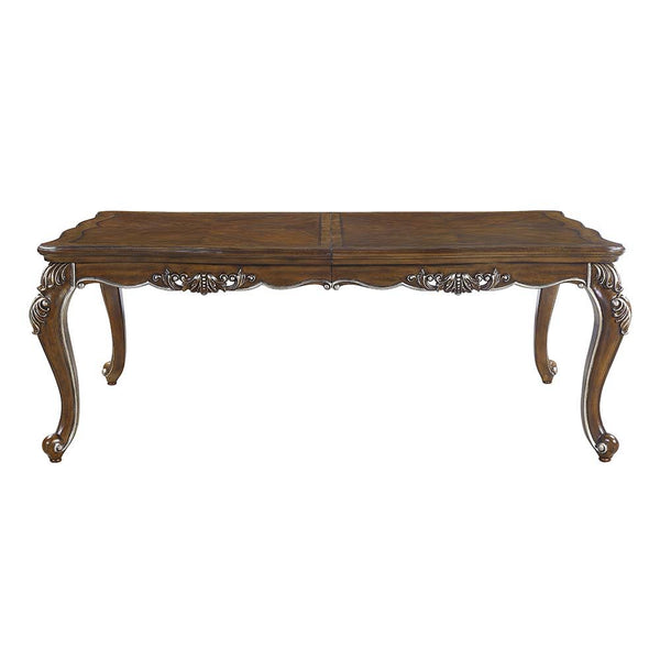  the Latisha dining table is the perfect merging of contemporary and classic. The antique oak finish with the hand-brushed silver trim accentuates the elaborate floral moldings that are showcased throughout the legs 