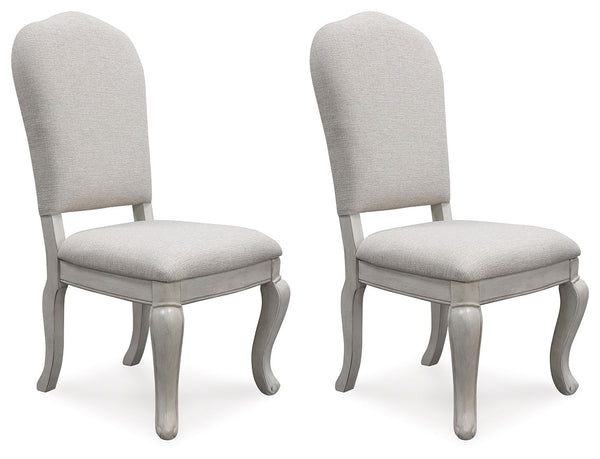  with a cushioned back and seat and cabriole-shaped front legs