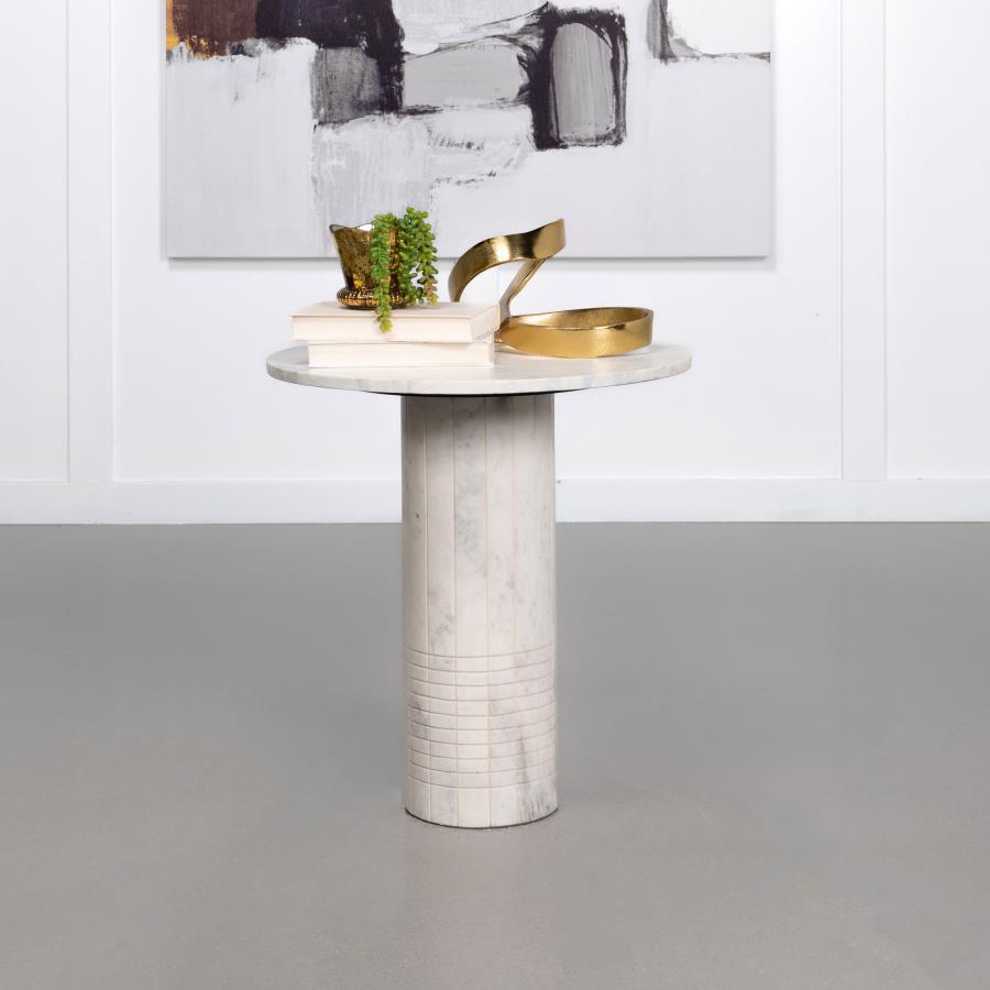 Nestled in a quiet corner, this end table embodies timeless elegance with its genuine white marble top and cylindrical pedestal base. The fluted design features subtle grid textures, reminiscent of neoclassical architectural details. This accent side tabl