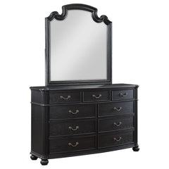 Reflect beauty and light in your sanctuary with this elegant dresser mirror. Framed in the same dark, rich tones as the set, it complements the dresser perfectly, creating a space where getting ready is done in style. The mirror invites light and depth in
