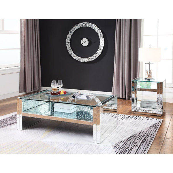The Nysa Coffee Table will add a contemporary touch to any room in your home. With its clean lines, this brilliant rectangular occasional table showcases a distinctive style for an intriguing look. The table features a fully mirrored sled base with an exq