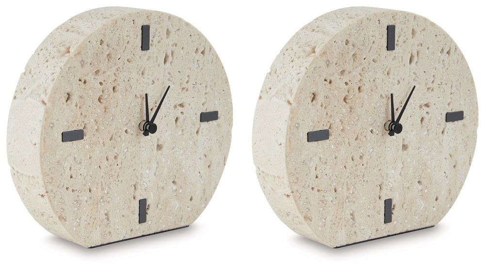 Take note of the time in contemporary style. Crafted from beige travertine, this clock is sure to lend minimalist flair to shelves and tabletops. Black accents provide a dramatic contrast to the earthy sensibility of the simple-yet-sophisticated timepiece