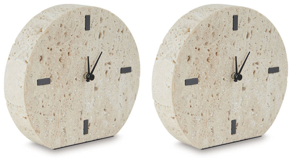Take note of the time in contemporary style. Crafted from beige travertine, this clock is sure to lend minimalist flair to shelves and tabletops. Black accents provide a dramatic contrast to the earthy sensibility of the simple-yet-sophisticated timepiece