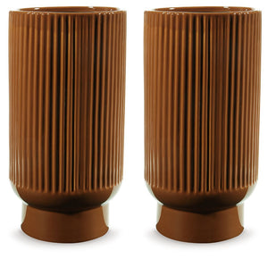 This ceramic vase makes a relaxed style statement. Its casual design and earthy burnt umber glaze complement your laid-back sensibilities. Delightfully simple and simply delightful, this vase subtly wows on its own or when filled with your favorite flower