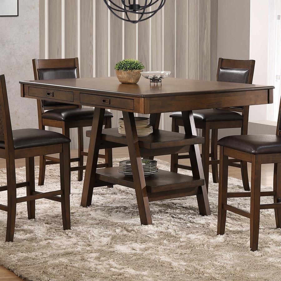 Entertain at this transitional counter height dining table, featuring ample seating space for up to six guests or family members. A rich walnut finish offers a neutral color palette and bold look to this furniture piece. With a raised counter height top, 