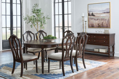 Serve up elegance and poise with the Lavinton dining package. Its traditional silhouettes are detailed with reeded accents for added opulence. From breakfast to dinner, this set elevates your dining experience with classic beauty. <h4><b>Lavinton - Brown 