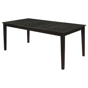  the elongated table and four side chairs boast an eye-catching distressed black finish. In a contrasting hue