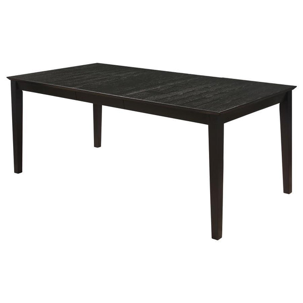  the elongated table and four side chairs boast an eye-catching distressed black finish. In a contrasting hue
