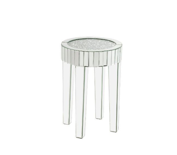 This piece strikes a sleek, clean-lined silhouette accented by faux diamonds and mirrored finish. Adding depth and dimension to your room while upping the wow factor in your home. This Ornat End Table is ideal for displaying your precious family photos an