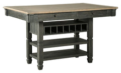 Invite your family into the heart of your home with this rectangular counter height dining room table. A beautifully textured black finish and a timeworn planked oak top create a unique two-tone contrast. The base provides plenty of storage for wine bottl