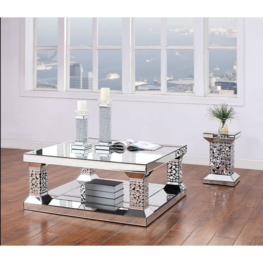 The Kachina Coffee Table will add a contemporary touch to any room in your home. With its clean lines, this brilliant rectangular occasional table showcases a distinctive style for an intriguing look. The table features a fully mirrored beveled frame with