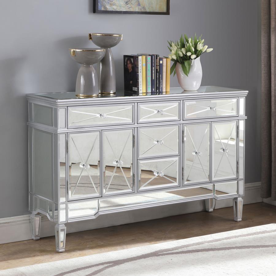 This mirrored accent cabinet has plenty of storage and panache. Fashioned from a combination of materials, it brings modern appeal and convenience to the home. It features birchwood and MDF construction in a silver finish to match the lustrous mirrored ac