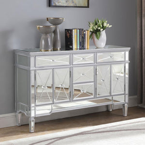  it brings modern appeal and convenience to the home. It features birchwood and MDF construction in a silver finish to match the lustrous mirrored ac