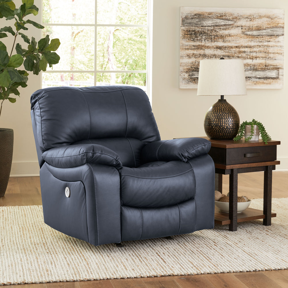 Focus on function. This practical power rocker recliner balances contemporary character and irresistible comfort. Its affordable, expertly matched leather and faux leather upholstery keeps your style up to speed without breaking the bank. Reclining with t