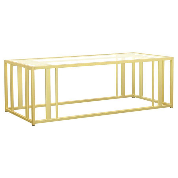 This modern rectangular coffee table features a clear tempered glass top paired with a geometric base made from heavy-gauge metal with a sleek electroplated finish. The open design offers a contemporary aesthetic, blending elegance with durability. Perfec