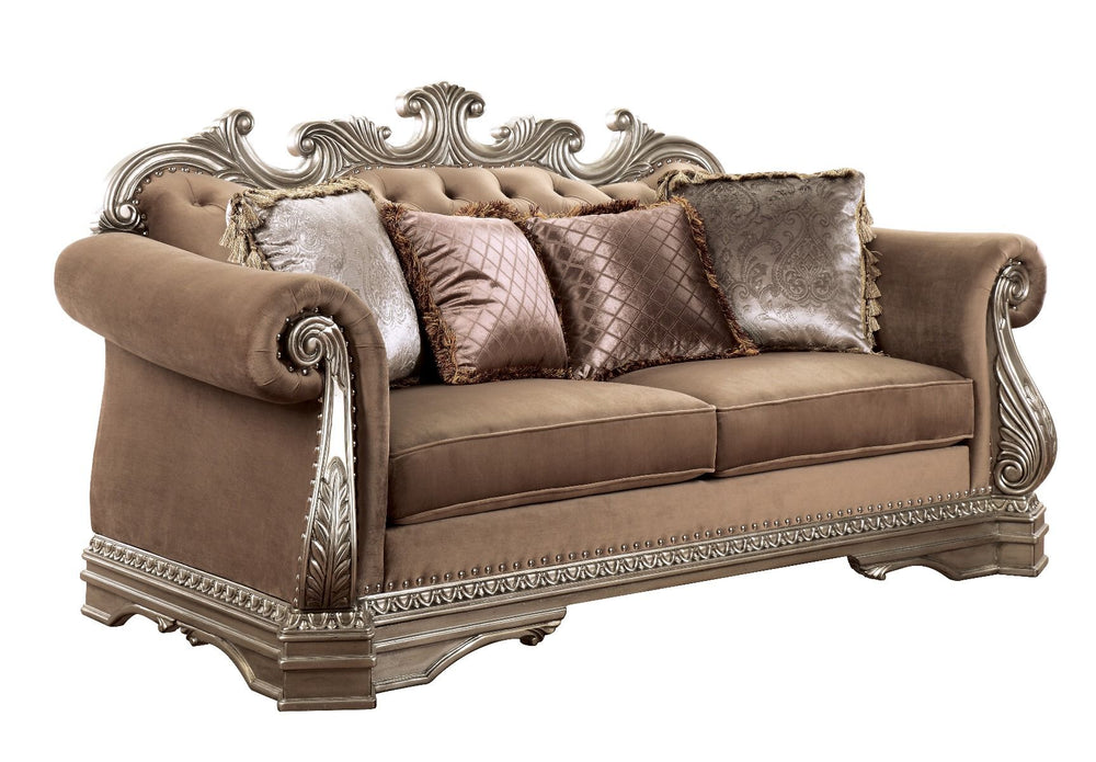 The Northville loveseat is exclusively designed and filled with romantic spirit. This beautiful velvet upholstered loveseat features carved legs, apron, and trim, decorated with raised and scrolled floral motifs in an antique silver finish. This sophistic