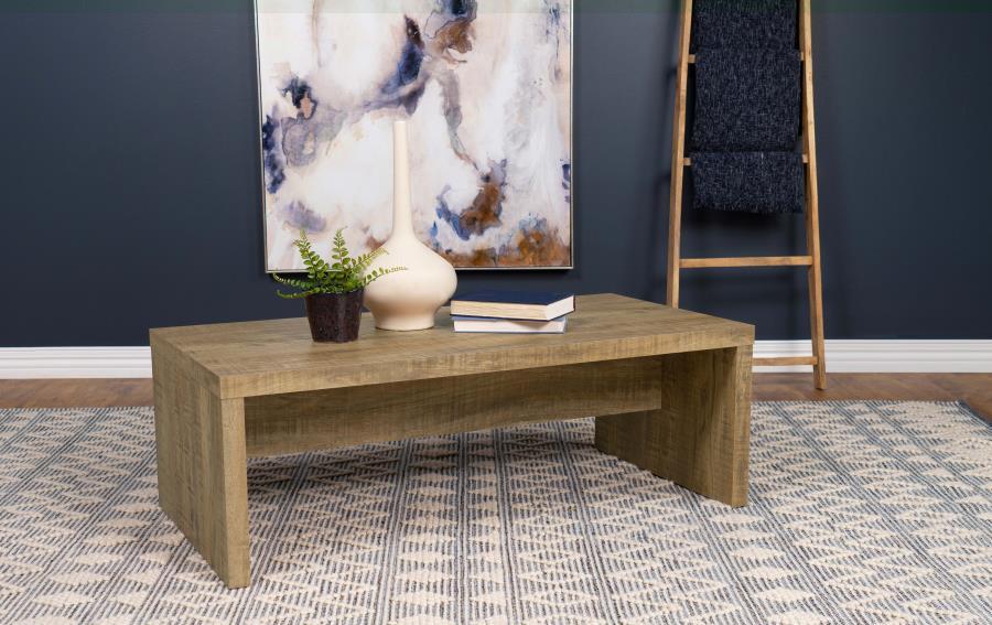 Rustic simplicity infuses a farmhouse coffee table with welcoming character. Charming in your living room, it-'s a clean silhouette with the look of roughhewn mango wood in a melamine paper finish. The rectangular table offers two solid sides and a center