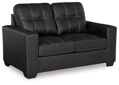Everyday comfort meets versatile style in this loveseat. The handsome hue of the goes-with-anything faux leather takes away the stress of styling, expertly pairing with your existing aesthetic. From kicking back on the weekends to relaxing post-work, livi