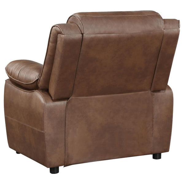  relaxed stance complete with pillowtop arms that invite relaxation. The armchair is upholstered in rich brown faux leather