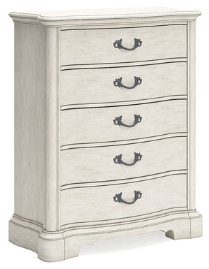 Add a touch of romance to your bedroom with this chest of drawers. Its antiqued white painted finish and serpentine-shaped silhouette details are the picture of easy elegance. Five spacious drawers offer ample storage space, while custom-designed bar pull